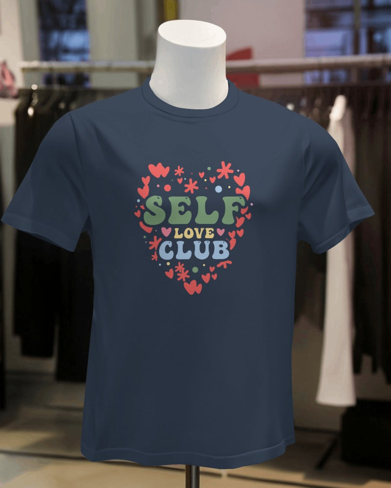 : "FYRA 'Self Love Club Heart' Front Navy Tee. Deep and empowering, perfect for celebrating self-appreciation and joining a community of self-love advocates with a touch of heart