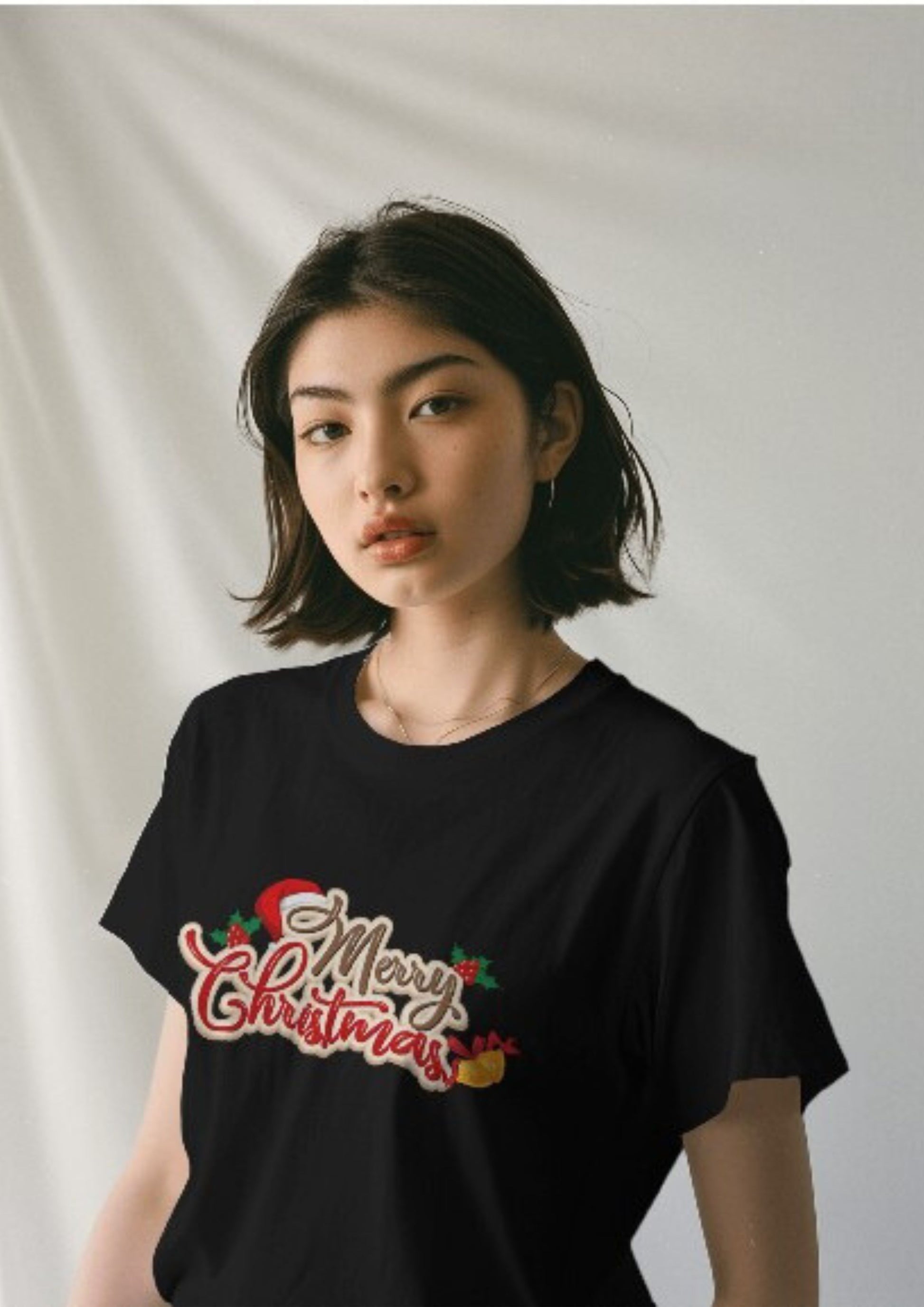 Merry Christmas with Jingle Bells across check on a Black Classic Crew Tshirt