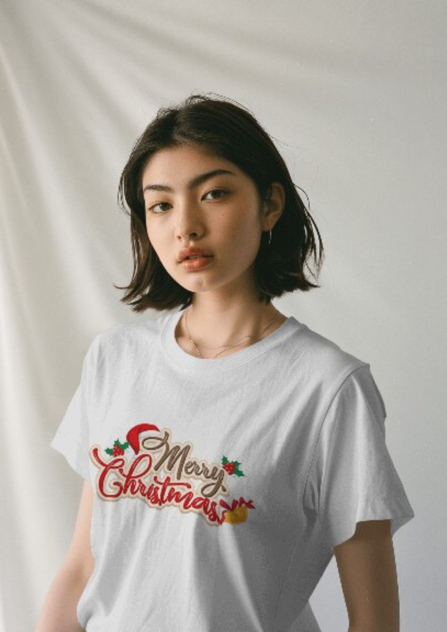 Merry Christmas with Jingle Bells across check on a White Classic Crew Tshirt